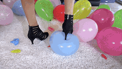 Balloons pop under sexy high heels
