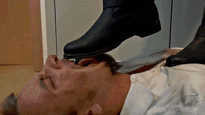 Making him lick my muddy boots while trampling him
