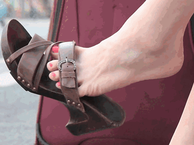 Marta shoe dangling at the bus stop