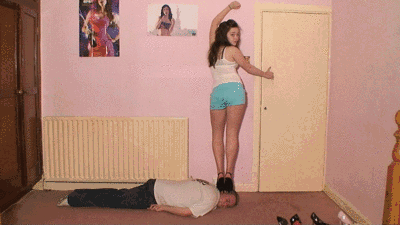Sexy Sophies Model Poses On Her Slaves Head